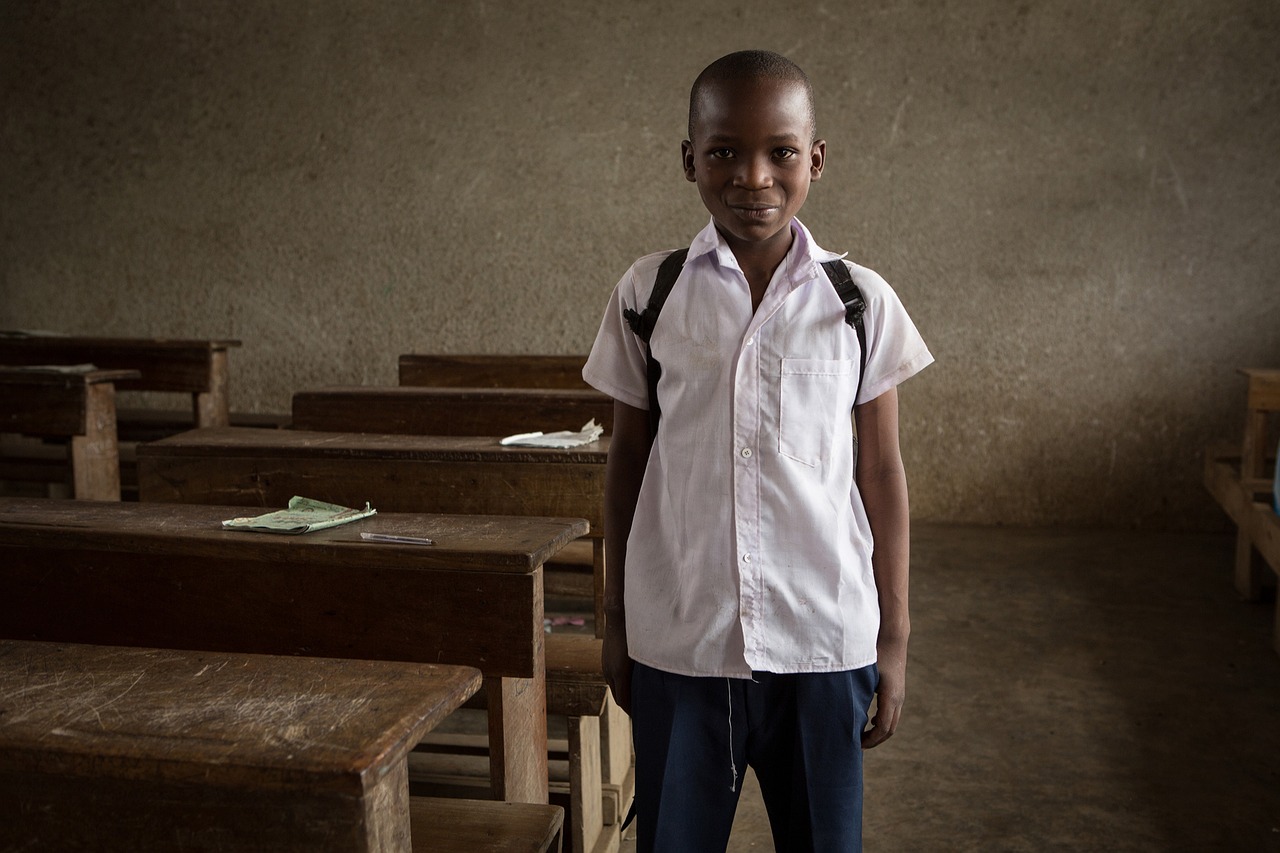 Rows of empty desks in a primary school classroom