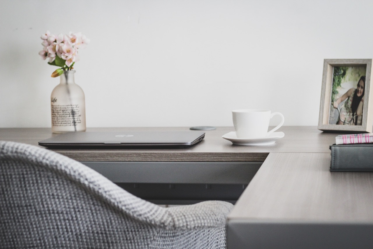 A laptop open on a table at home