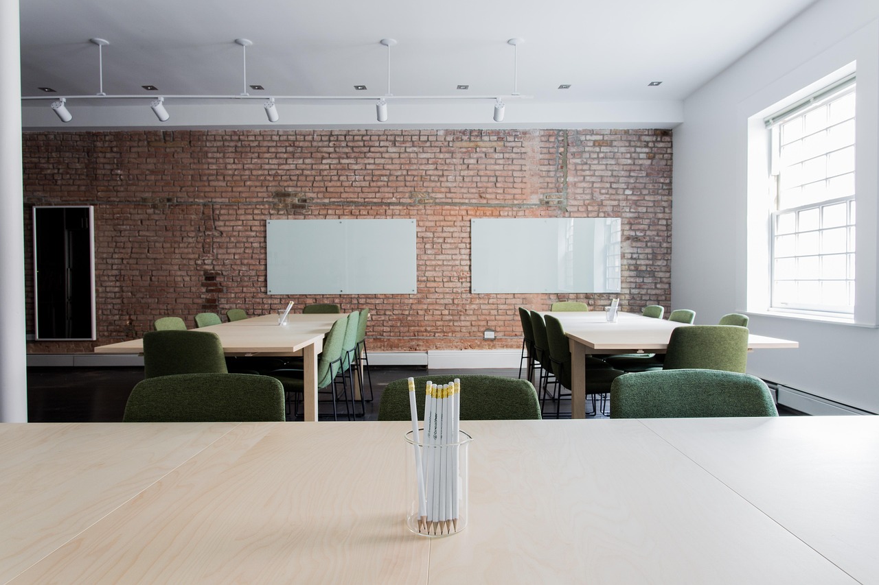 Two empty chairs beside a window