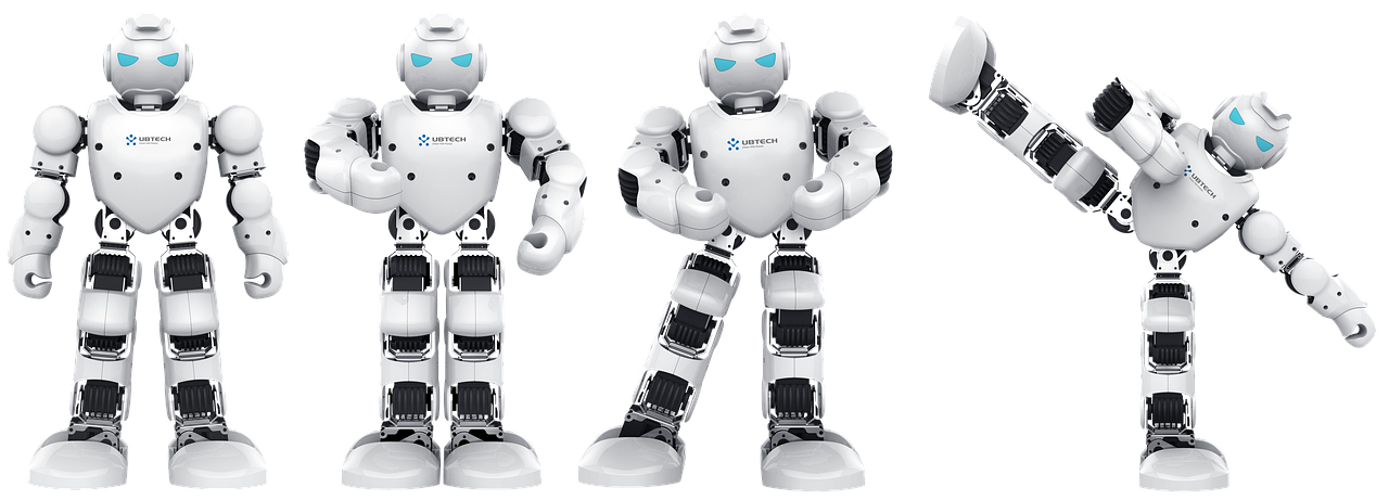 A small toy robot sitting on a carpet