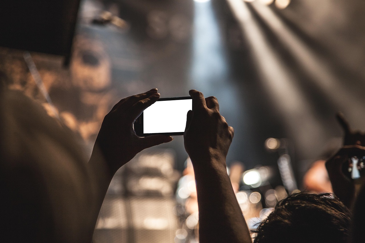A phone glowing in a dark room